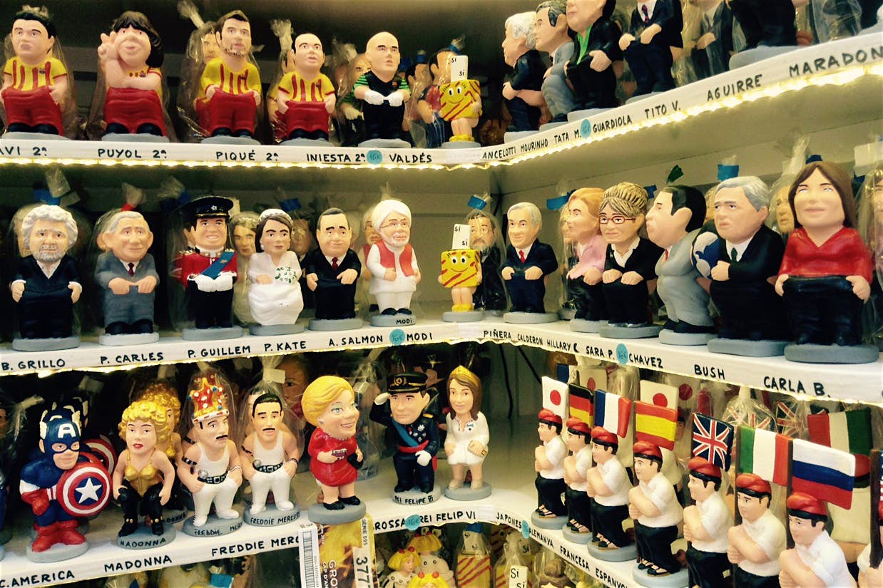 Some familiar faces take on the role of caganer at Christmas in Barcelona. Image by Sally Davies / Lonely Planet
